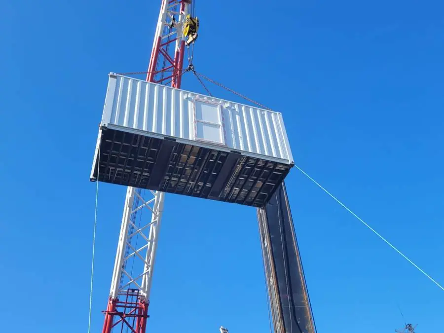 Module lifted by crane at the quay